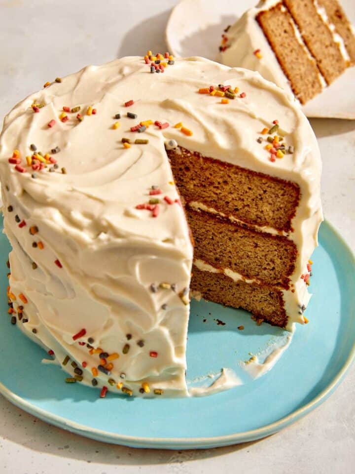 Smash cake on a plate with a slice out.