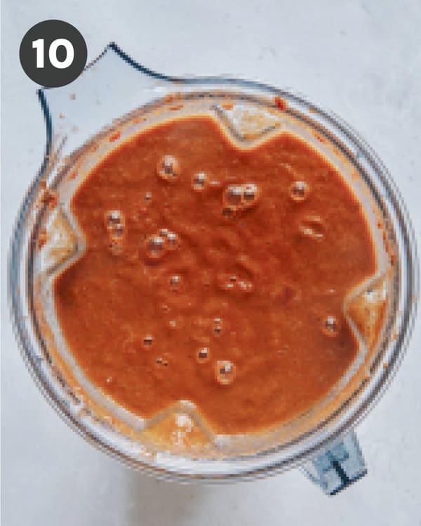Freshly blended tomato soup in a blender.