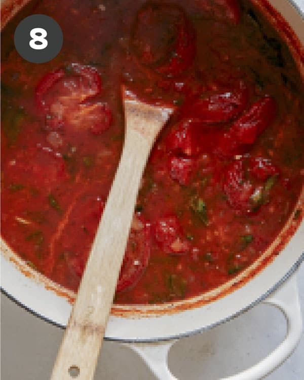 Tomato soup simmering in a stock pot. 