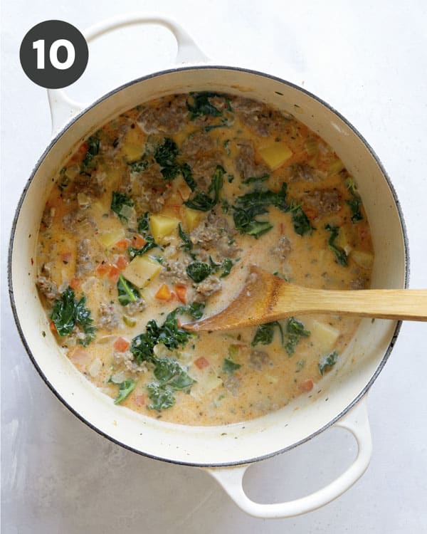 A stock pot full of Zuppa Toscana. 