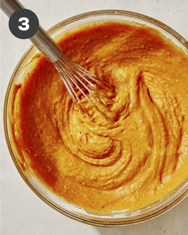 Pumpkin batter for baked pumpkin donuts.