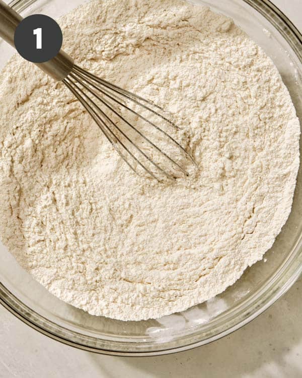 Buttermilk biscuit dry ingredients in a bowl with a whisk.