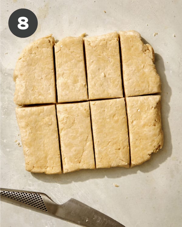 Buttermilk biscuit dough cut into rectangles. 