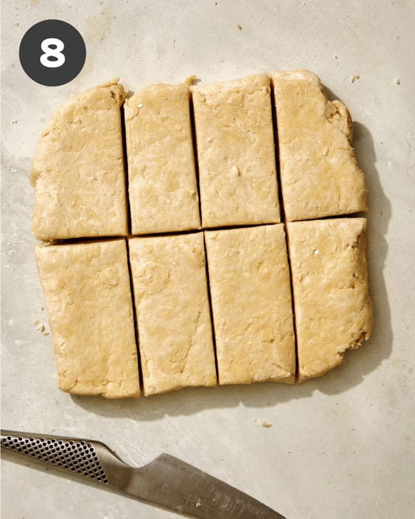 Buttermilk biscuit dough cut into rectangles.