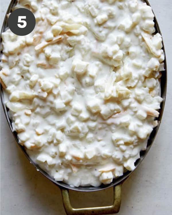 Cheesy potato casserole in a baking dish.