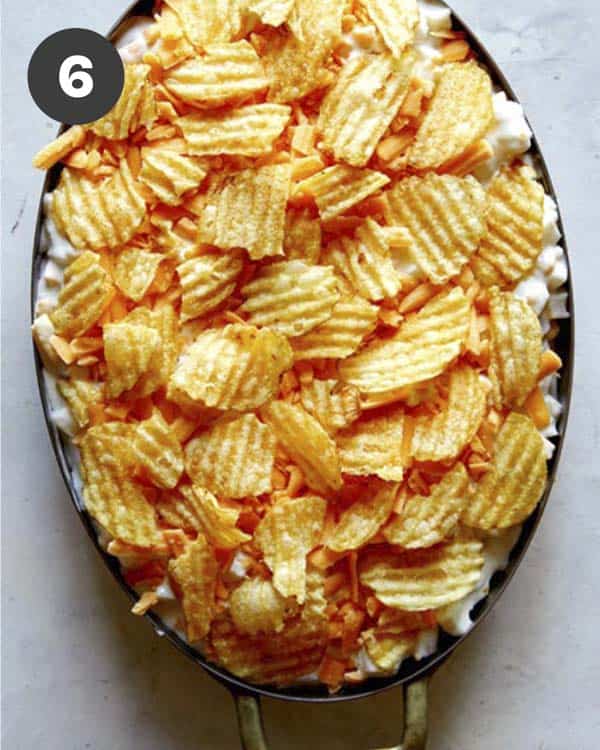 Cheesy potato casserole in a baking dish before its baked.