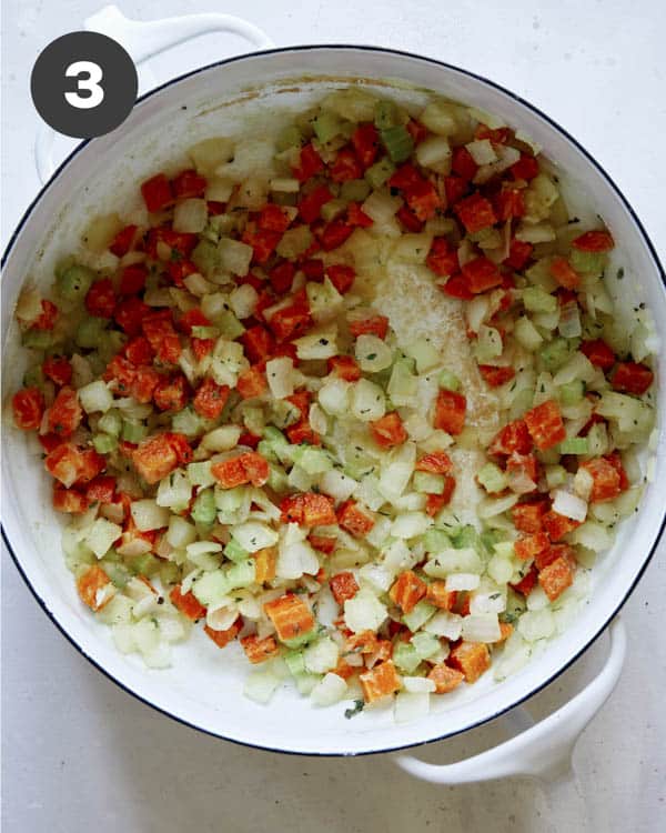 Vegetables in a pot with flour and herbs.