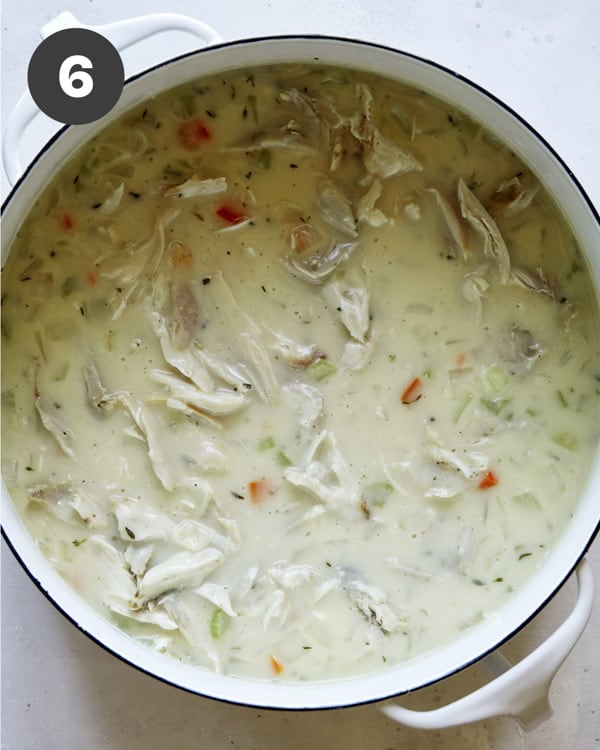 Chicken soup in a pot for chicken and dumplings.