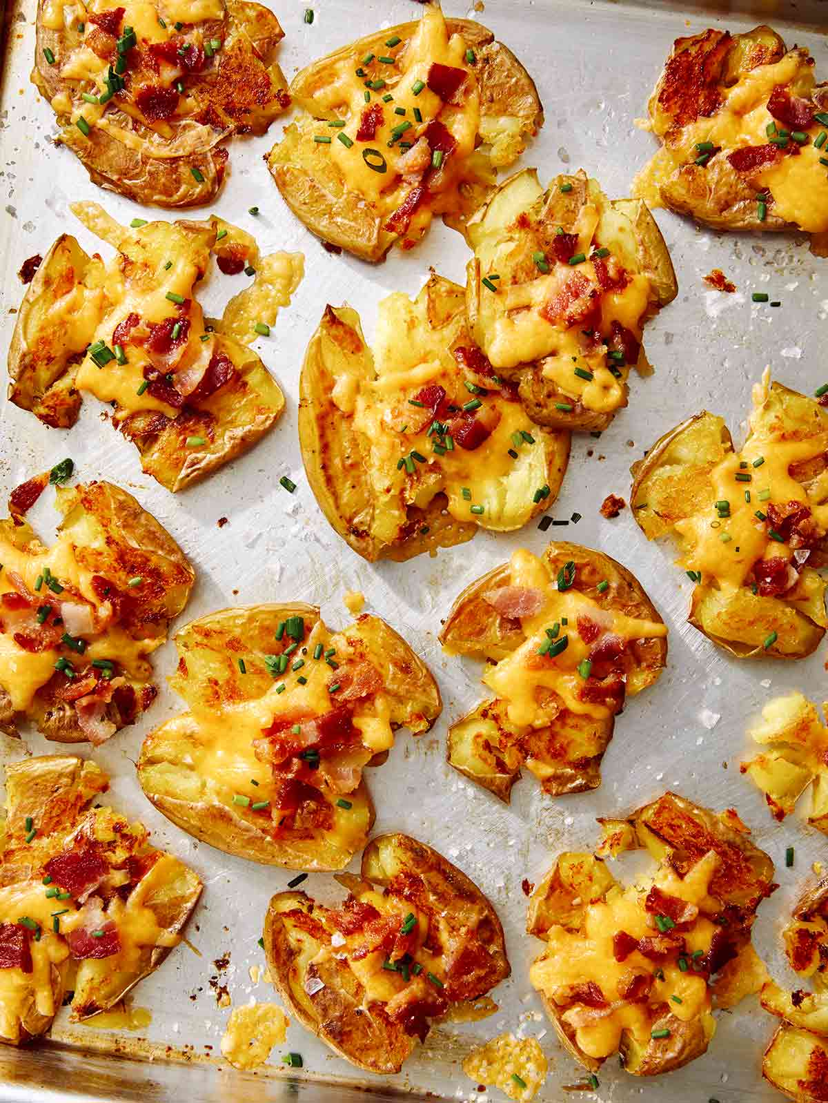 Close up on smashed potatoes on a platter.