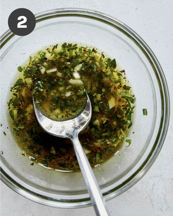 Roast beef marinade whisked together in a bowl.