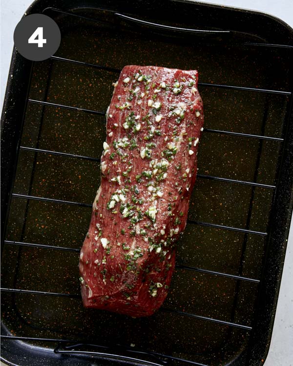 Roast beef in a roasting pan.