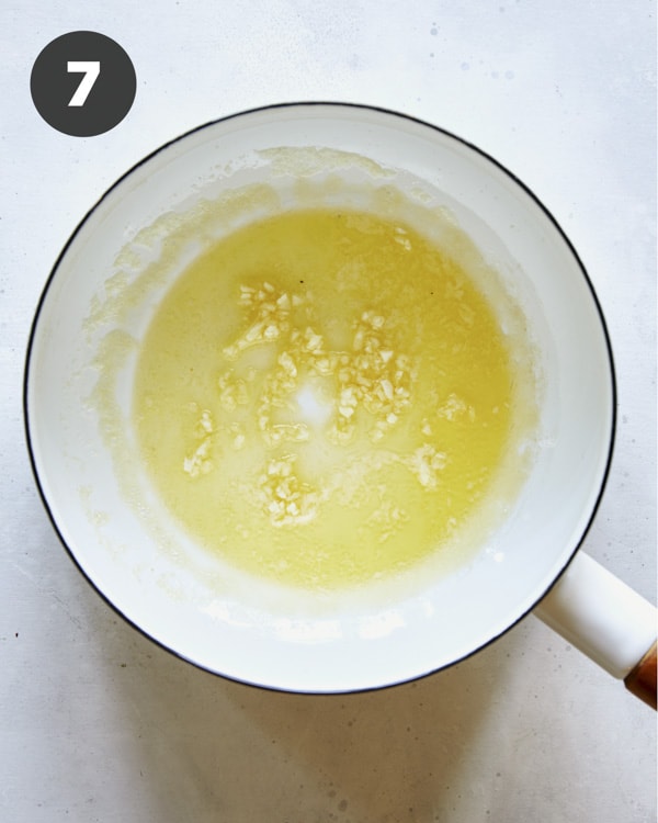 Butter with garlic in a sauce plan.