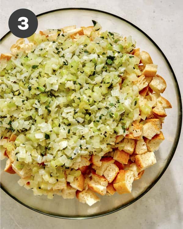 Stuffing being mixed in a bowl. 