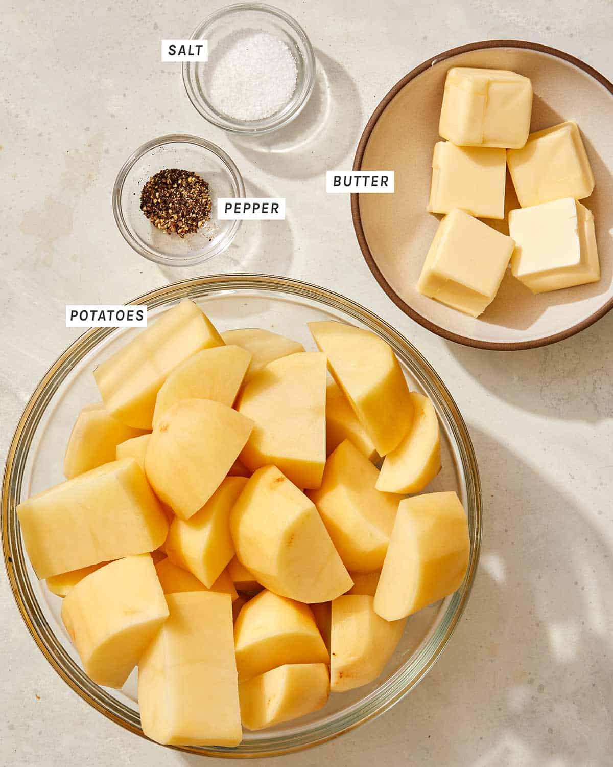 Mashed potato recipe ingredients in a kitchen. 