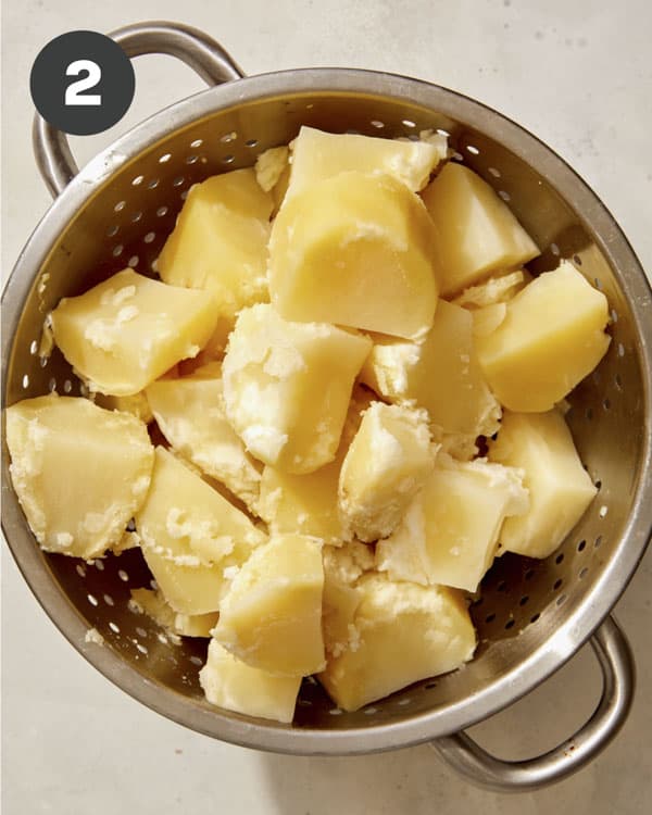 Potatoes in a colander draining.