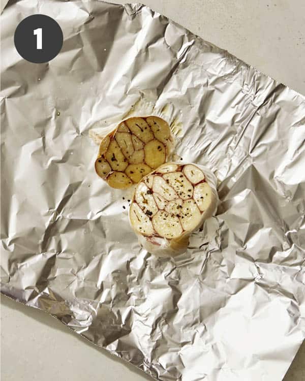 Roasted garlic on foil with olive oil and salt and pepper. 