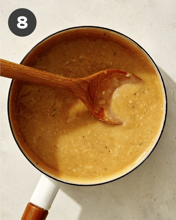 Roasted garlic gravy in a pot.