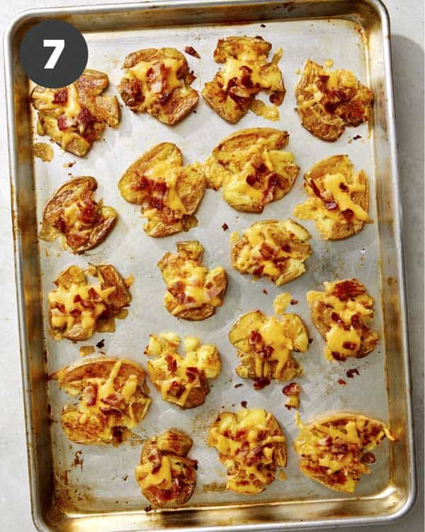 Smashed potatoes topped with cheese and bacon. 