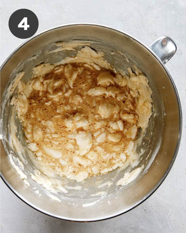 Snickerdoodle cookie dough being mixed in a bowl.