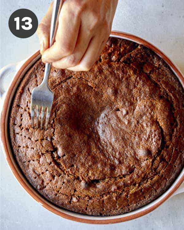 Poking sticky toffee pudding with a fork.