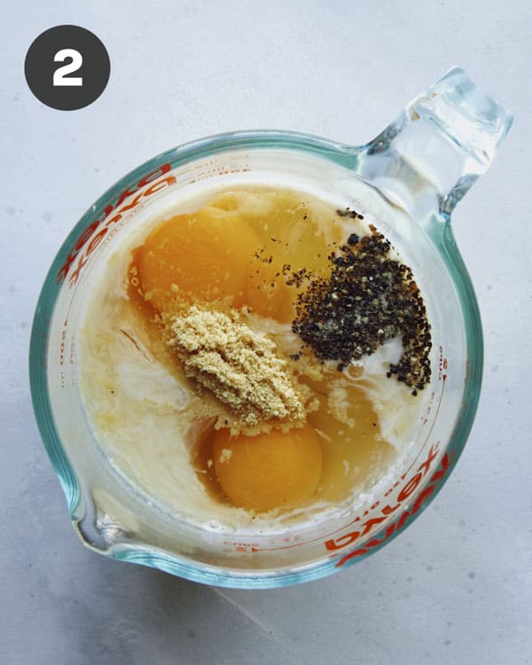 Cheese sauce ingredients mixed in a bowl.