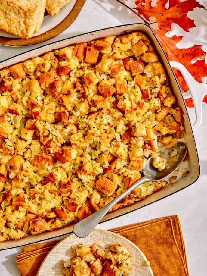 Stuffing in a baking dish with a scoop taken out.