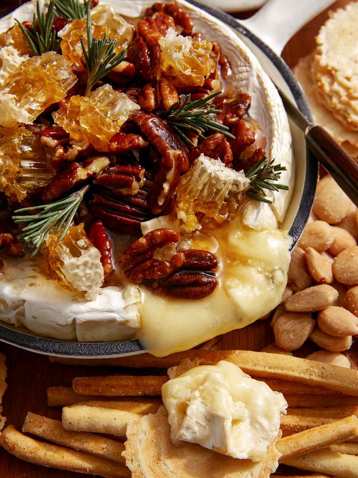 Baked brie with pecans on top. 