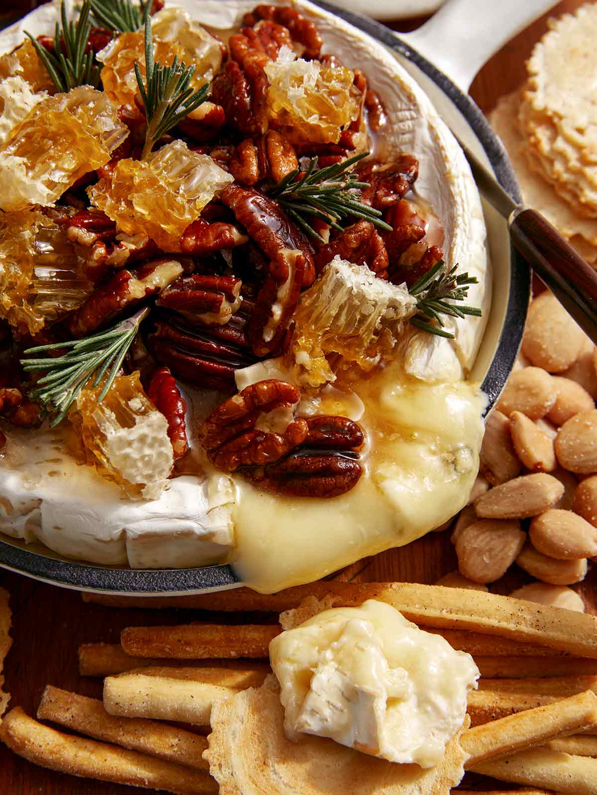 Baked brie with pecans on top.