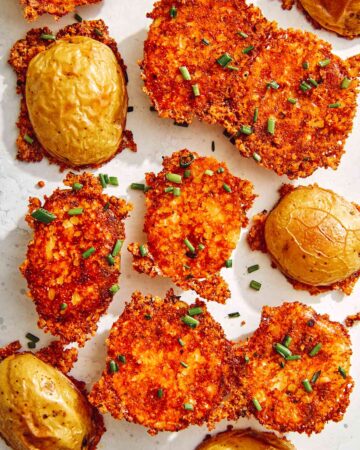 Crispy parmesan potatoes sprinkled with chives.