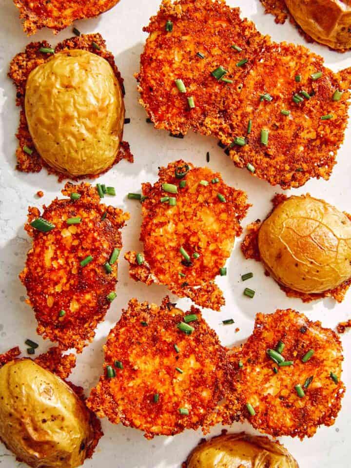 Crispy parmesan potatoes sprinkled with chives.