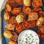 Crispy parmesan potatoes served on a platter.