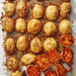 Crispy parmesan potatoes in a baking dish.