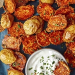 Crispy parmesan potatoes served on a platter.