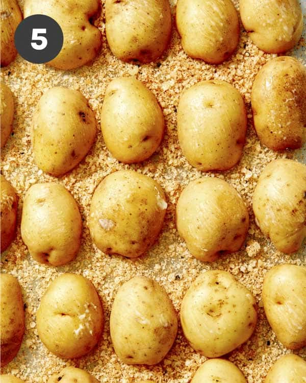 Crispy parmesan potatoes in a baking dish.