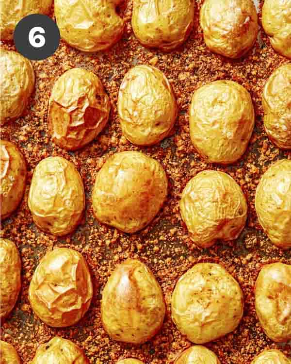 Crispy parmesan potatoes in a baking dish ready to be served. 