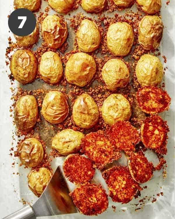 Crispy parmesan potatoes in a baking dish.