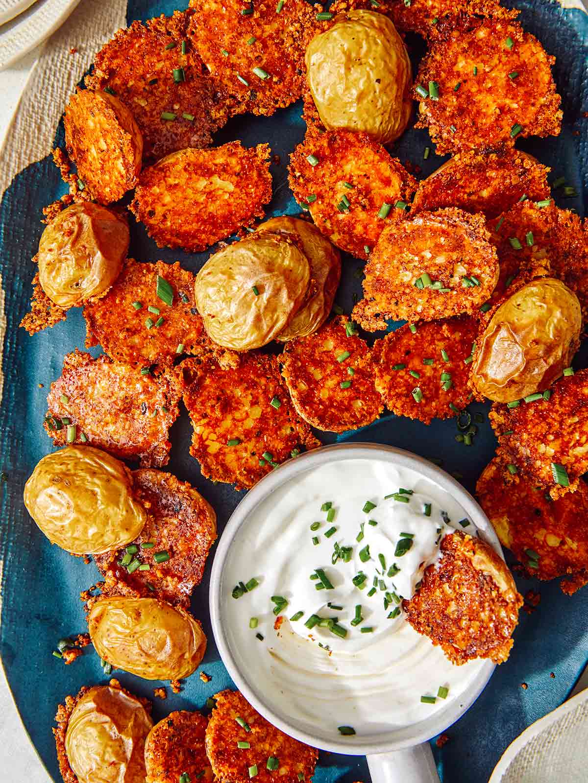 Crispy parmesan potatoes served on a platter. 