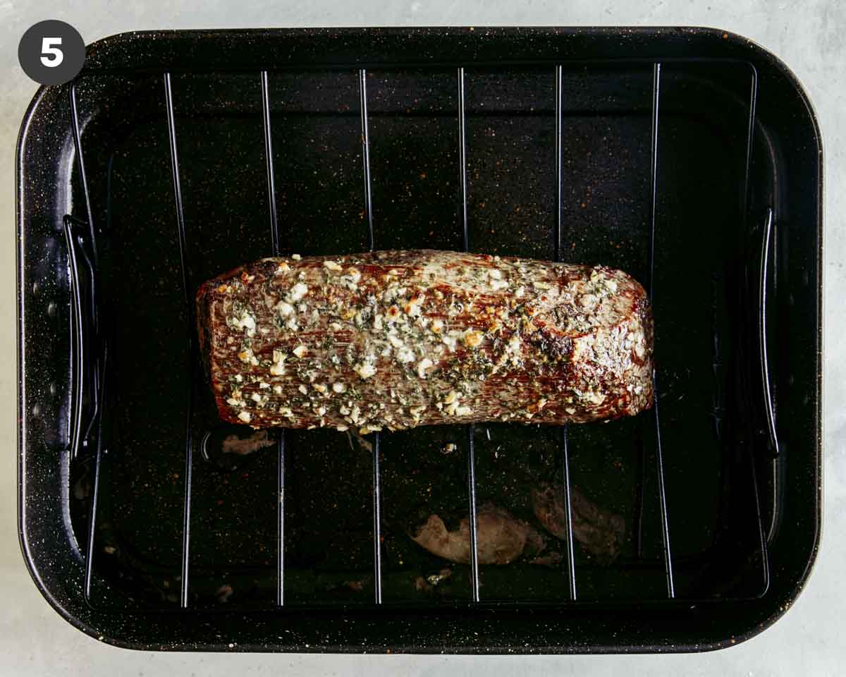Roast beef roasted in a pan resting.