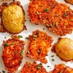 Crispy parmesan potatoes sprinkled with chives.