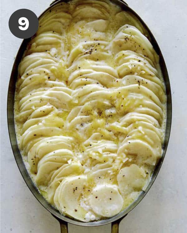 Potatoes gratin with salt and pepper on top.