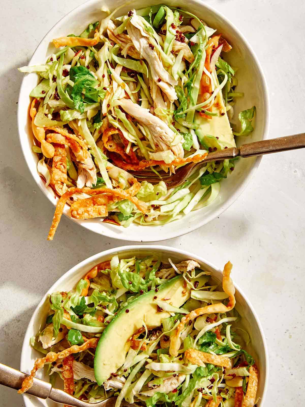 Sesame ginger chicken salad in two bowls. 