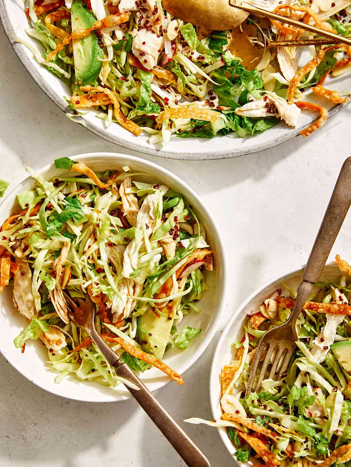 Sesame ginger chicken salad in two bowls. 