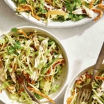 Sesame ginger chicken salad in two bowls.