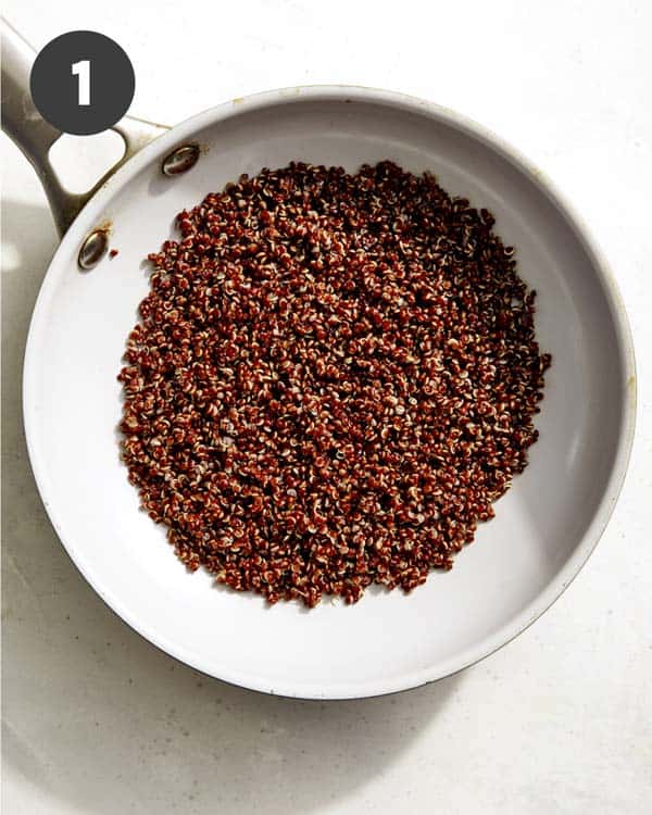 Quinoa in a skillet to be toasted.