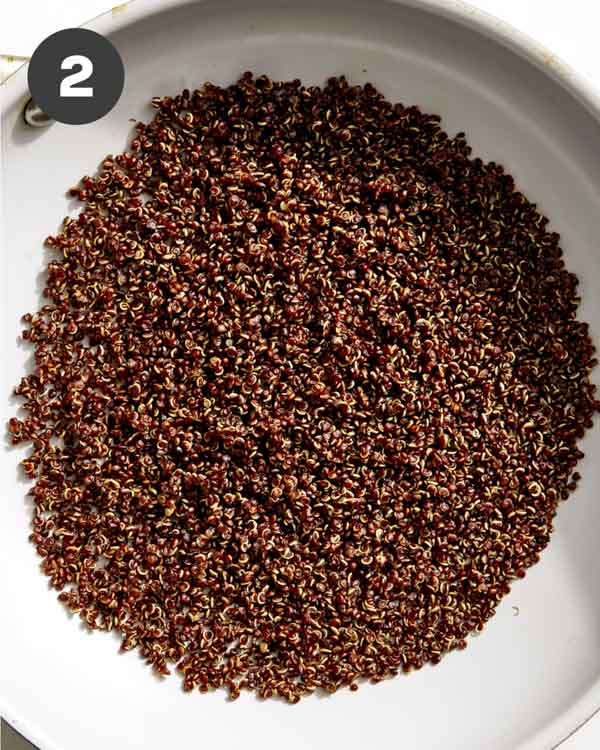 Crispy quinoa in a skillet.