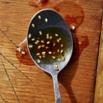 Sesame ginger dressing on a spoon.