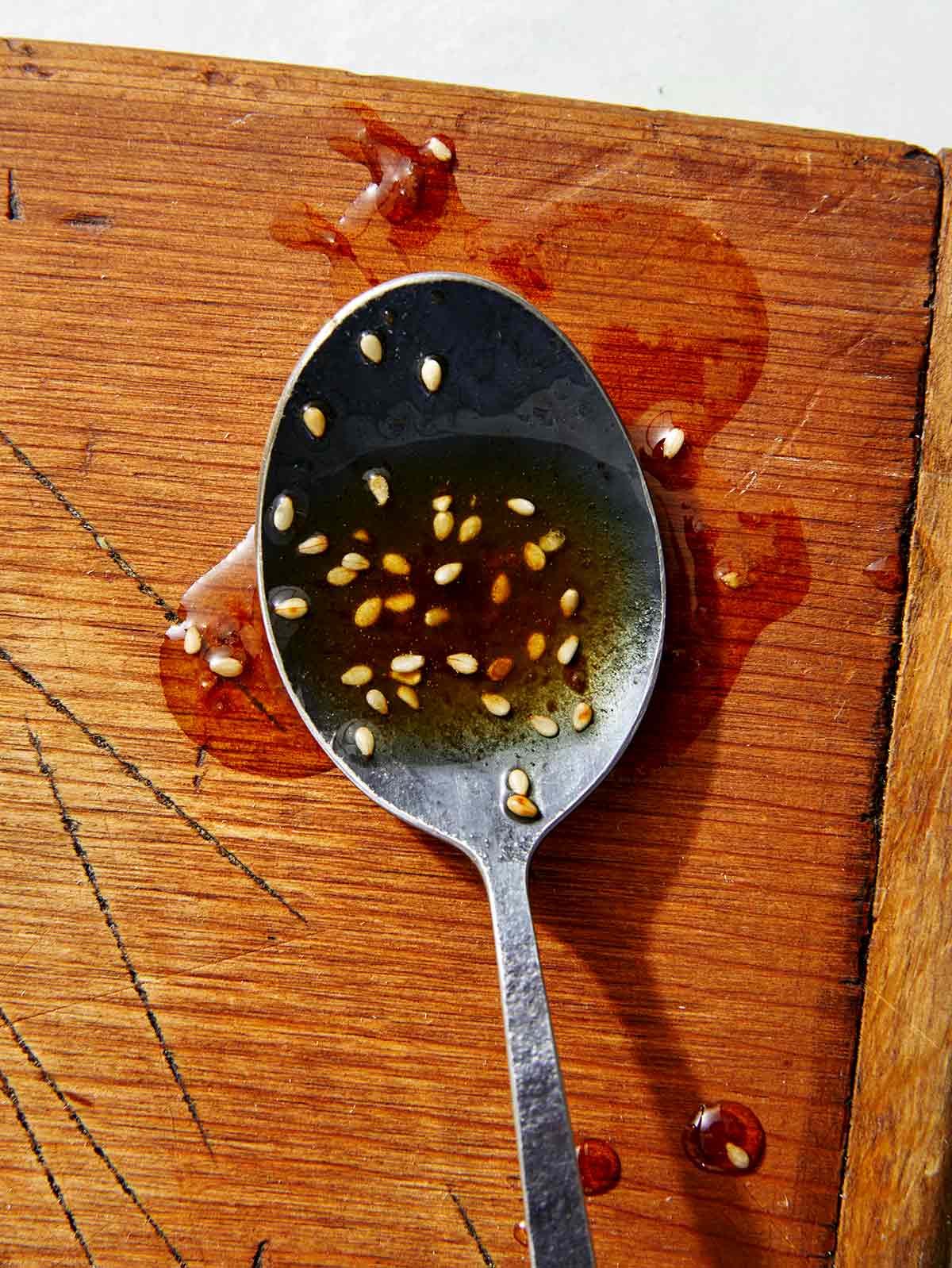 Sesame ginger dressing on a spoon. 
