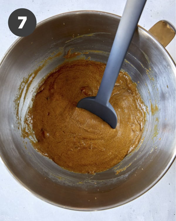 Eggs, cream, and sugar in a bowl for sticky toffee pudding.