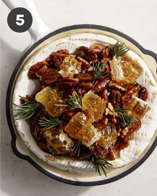 Baked brie in a skillet and topped.