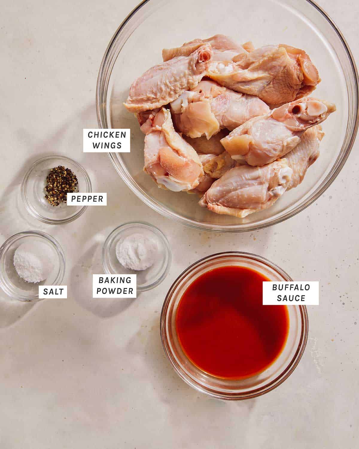 Air fryer buffalo wing ingredients in a kitchen. 